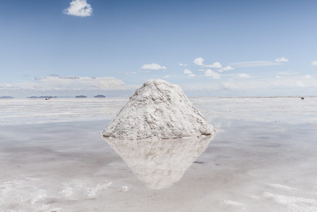 Hill of snow on the frozen lake with the sky in the background